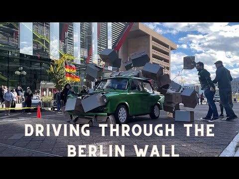 Driving Through The Berlin Wall at the 15th Annual Parade of  Trabants