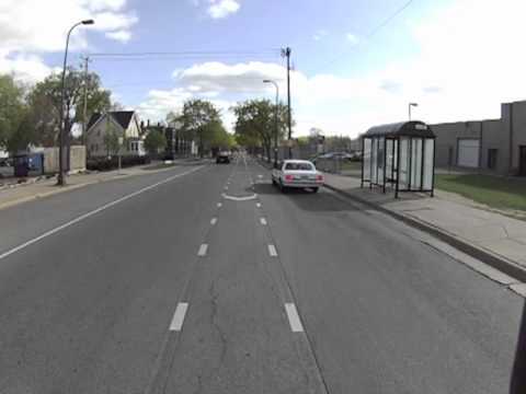 Motorists blocks the bike lane and bus stop and passenger almost doors cyclist