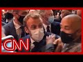 French President Macron hit with egg during event