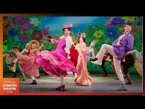 Mary Poppins musical trailer frame of Mary and Bert dancing with chimney sweeps on a London rooftop