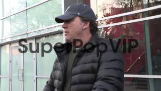 Jim Belushi and Jared James Belushi greet a fan at the La...