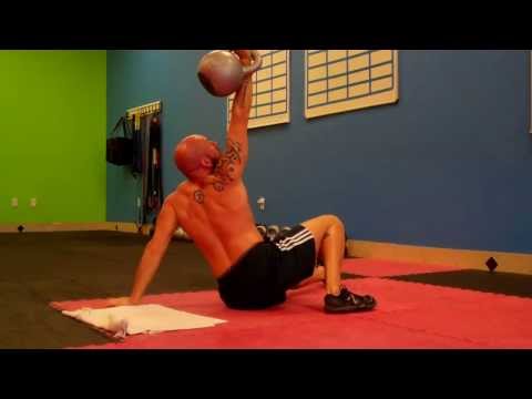 Performing Turkish Get-ups with a 32kg (70lbs) Kettlebell on Each Side Yo!