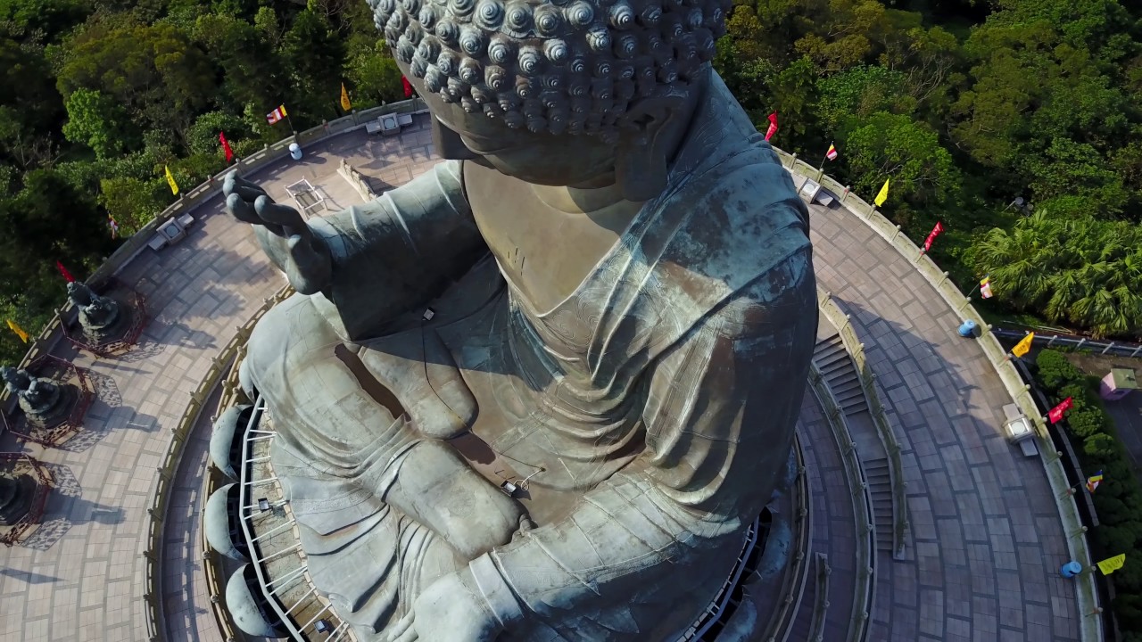 Watch stunning mountain views from the base of the Big Buddha.