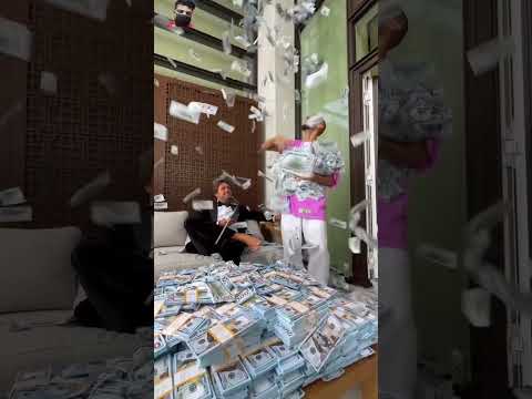 Millionaire guy shows cash stacks