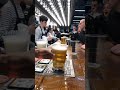 Fast-pouring beer technology at Tottenham’s new stadium - filling through the bottom of the cup