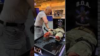 EMS World Expo Attendee puts X8T Tourniquet on in 5 Seconds!