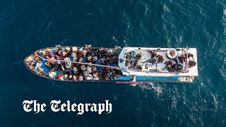 video: At least 12 refugees die on boat stranded at sea without food or water