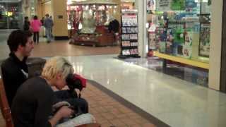 girl plays virtual boy at mall