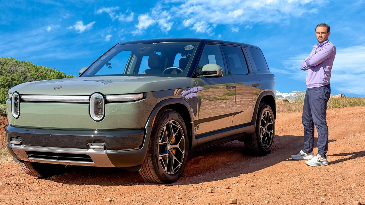 Rivian R2 driving on mountain road in Utah at launch event