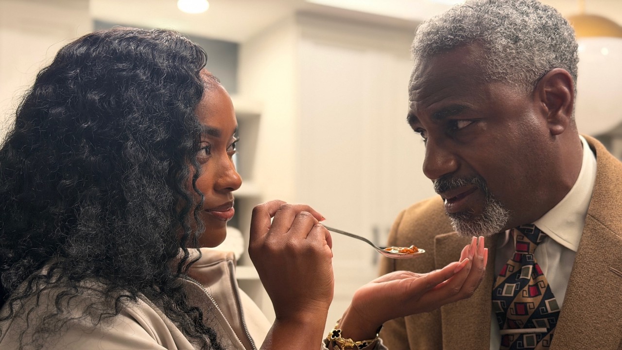 Nina's friend feeds Mr. Mitchell from her spoon!