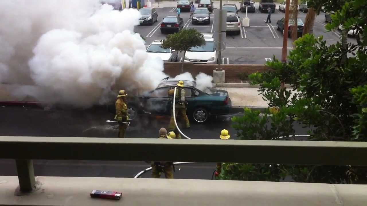 Burning Car Explodes Right On Firefighter's Face, Keeps Working