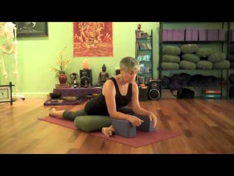 Kate Stiver demontrates Pigeon Pose with Props