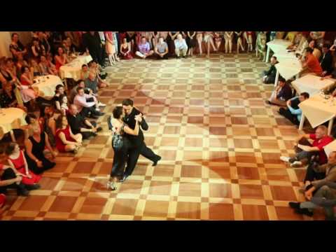  Milena Plebs  and  Sergey Sokhnenko  are  dancing  to  the  tango  "  Farabute  "  by  Juan D'Arienzo  at  White Nights tango festival  in  2017