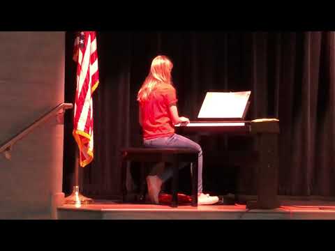 Lauren playing piano to “lost boy” while choir girl sings