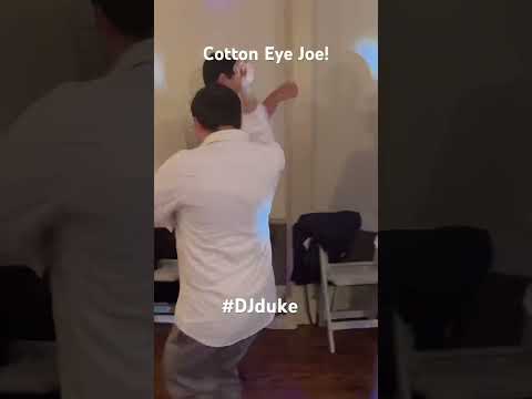 Wedding guests enjoy Cotton Eye Joe