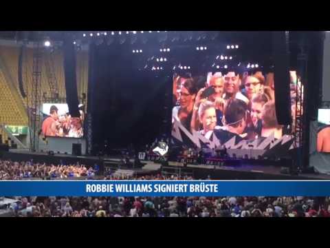 Robbie Williams signiert Brüste