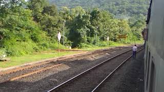 preview picture of video 'Ganpati special train crossing 22654 NZM-TVC EXPRESS at aravali road konkan railway'