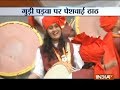 Women ride bikes wearing traditional Maharashtrian sarees during Gudi Padwa celebrations