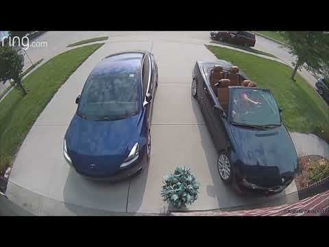 Guy Backing Out BMW Convertible, From Garage, and a Tesla Same Time