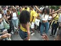 BRAZILIAN GIRLS DANCE SAMBA AT BRAZILIAN CARNIVAL CULTURE PARADE STREET PARTY