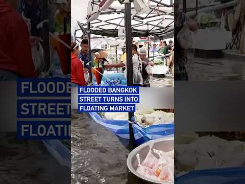 Flooded Bangkok street turns into floating market