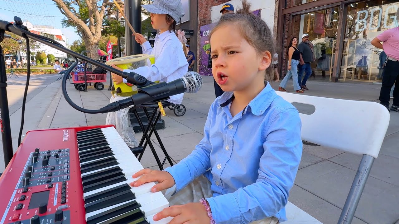 Adorable 4-Year-Old Sings “Baby Shark” in Public — Crowd in Awe When Sister Joins on Violin!