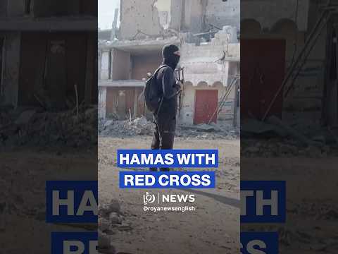Hamas fighters and Red Cross vehicles wait to cross Gaza Yellow Line