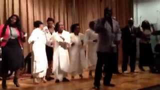Pastor Luther Barnes and the congregation ministers "You keep on blessing me" at the Culture Art Ctr