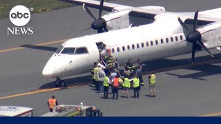 Passengers who helped restrain pilot during mid-air emergency speak out