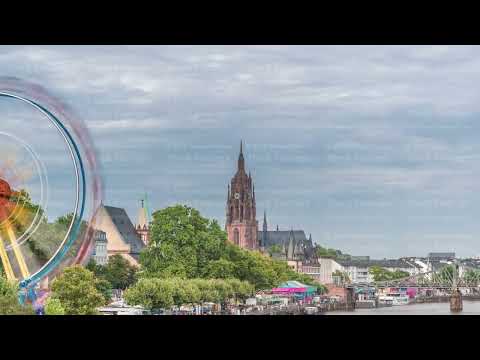 Aerial hyperlapse of pleasure boats on the Rhine Main, framed by the spire of Kaiserdom St