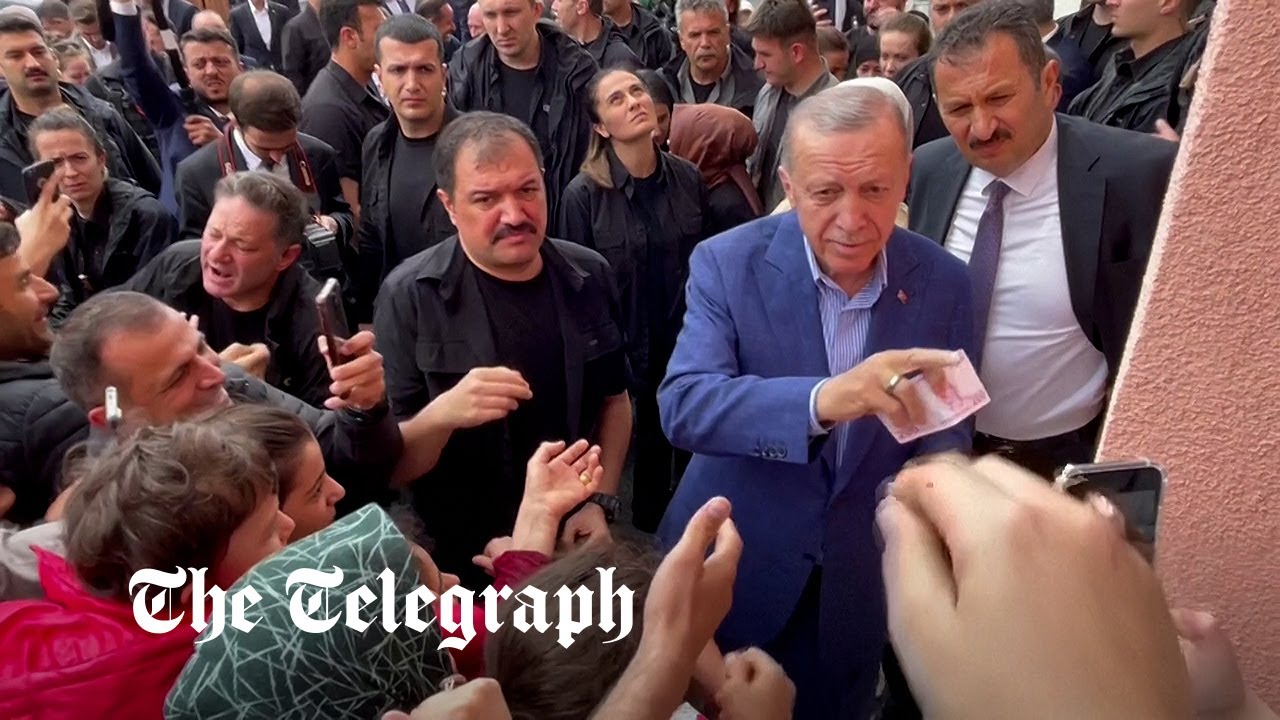 President Erdogan seen handing money to voters at polling station - Vimarsana News