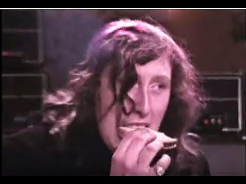 Atomic Rooster 70's band singer eats sandwich on stage live Black Snake