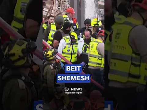 'Israeli' rescue teams recover bodies after direct Iranian hit