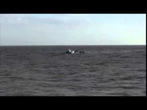 Coast Guard rescues 2 from capsized tug boat