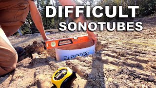 Placing 9 Sonotube Concrete Forms in Very Sloppy Holes [and Bedrock]