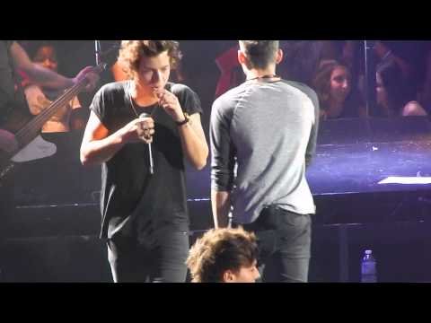 One Direction - Back For You - Harry eats lollipop thrown on stage - Toronto July 9th, ACC