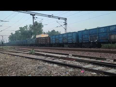 WAG 9 full speed With 57 freight coaches