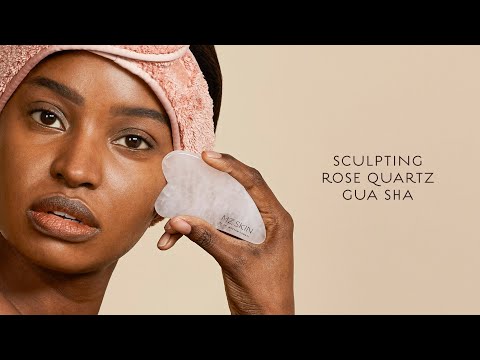 Part of a video titled SCULPTING ROSE QUARTZ GUA SHA - YouTube