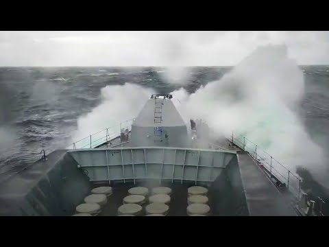 Seamanship - sailors on the focsle of HMS Sutherland in heavy weather