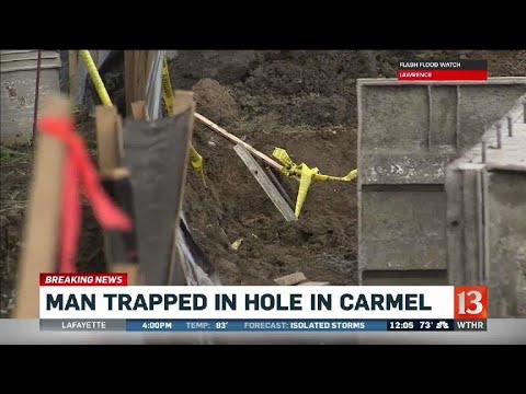 Man trapped in hole