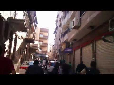 هروب مشيّعي باسل شحادة بعد هجوم قوات الأمن عليهم قرب الكنيسة في حي القصاع في مدينة دمشق