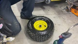 How to Fix a flat or a slow leak on a John Deere Lawn Tractor, D130, 100 series.  ( plug kit )