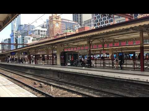 Pacific National G525 and G531 lead the down Long Island Steel Train at Flinders Street Station