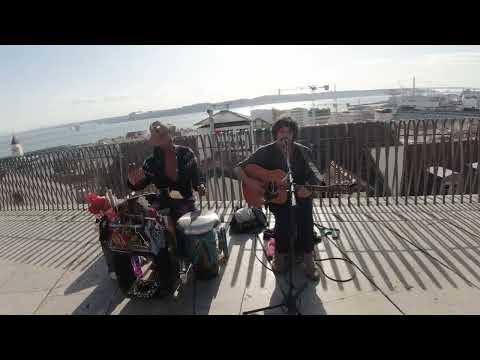 psychedelic street musicians with the amazing Lisbon view