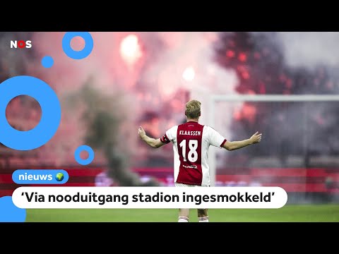 Ajax-publiek steekt vuurwerk af: wedstrijd gestaakt, kinderen balen