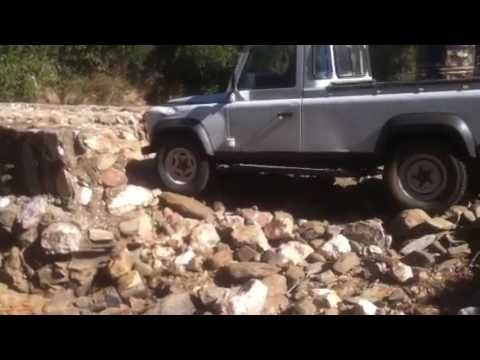 Land Rover crossing a swept bridge