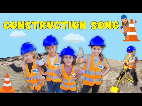 Five children in orange safety vests and blue hard hats pose on a sandy construction site with a bright blue sky and the words 'CONSTRUCTION SONG' above them.