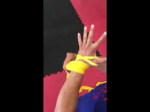 How to wrap your hands for boxing with Coach Nelson