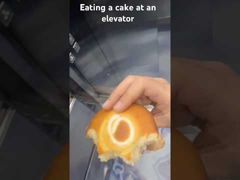 Eating a cake at an elevator!
