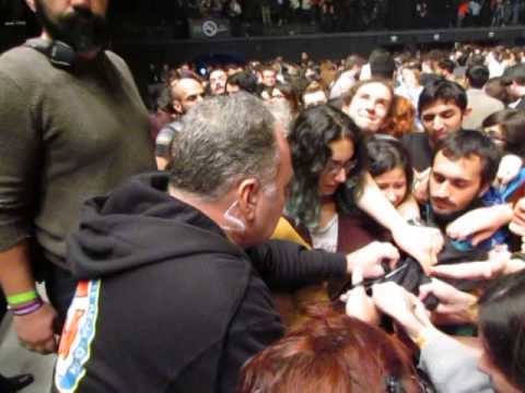 Someone from Morrissey's crew runs with a scissors and cuts the shirt for fans (Istanbul)